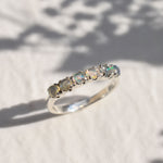 Natural Fire Opal cabochon half eternity ring in solid 925 sterling silver, designed with dainty cabochon stones for timeless elegance and flashes of fire colors. This ring highlights durability and everyday wear while being lightweight and comfortable. As the October Birthstone, Fire Opal makes a meaningful gift for birthdays, anniversaries, or special occasions. Perfect to wear at weddings, cocktail parties, and festive celebrations.