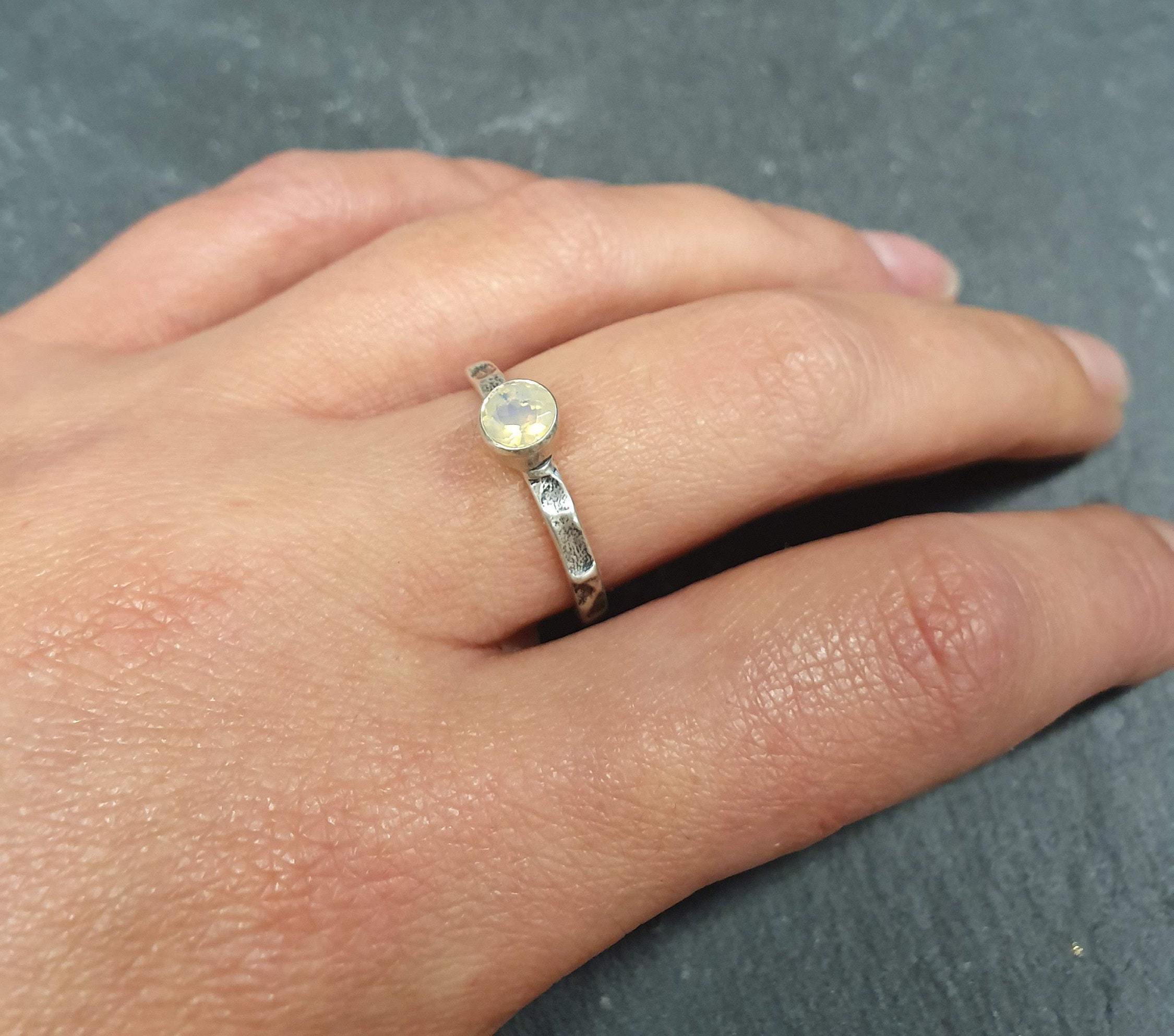 Ethiopian Opal Hammered Solitaire Ring worn on the middle finger with nude nails, paired with a white linen sundress and strappy sandals; the oxidized silver bezel keeps it low profile and secure for all-day errands; perfect for brunch, farmers markets, and park picnics.Worn for office days, brunch dates, music festivals, casual weekends, and small weddings.