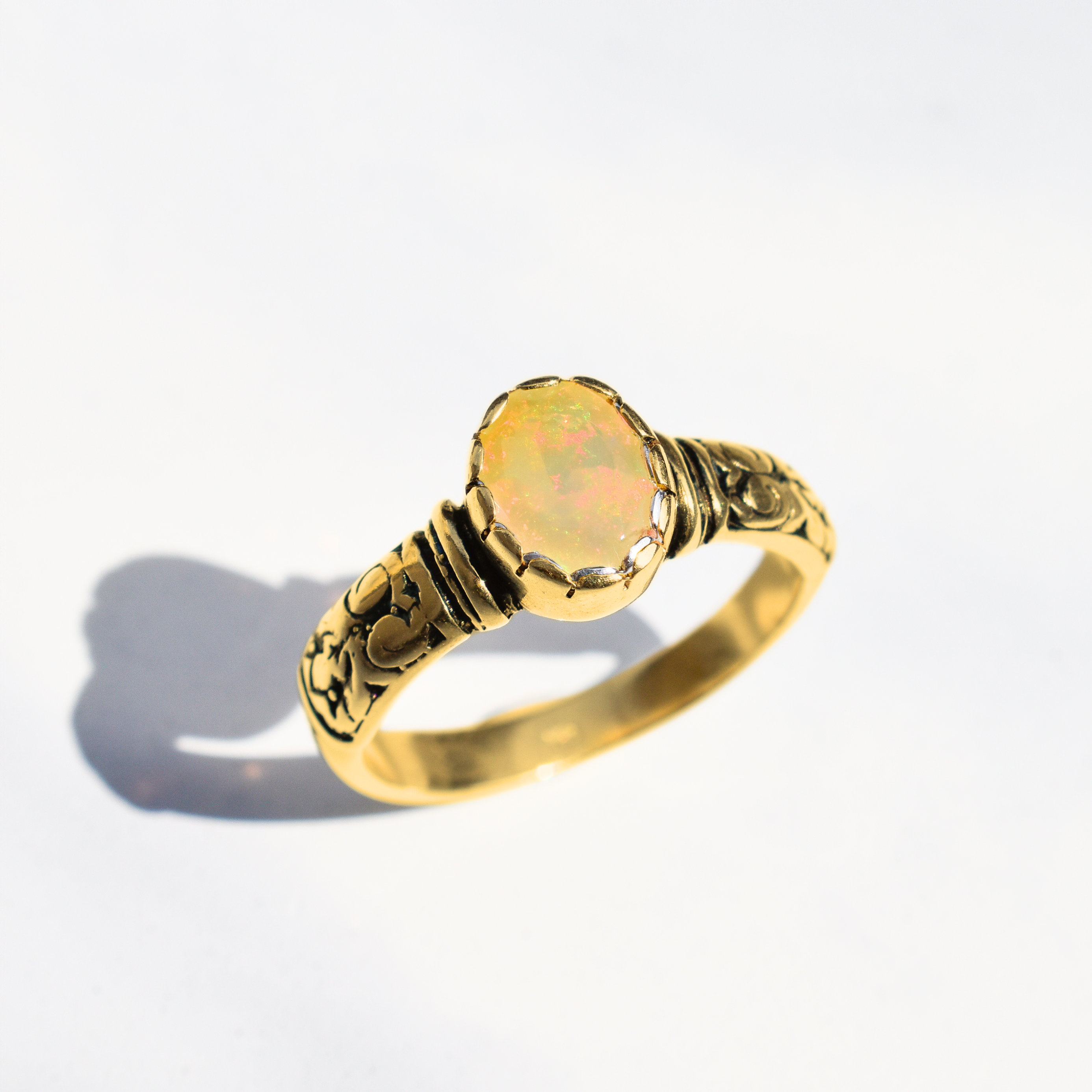 Ethiopian Opal October Birthstone Ring with tribal boho engraved gold band featuring flashes of fire colors, designed for artistic style and uplifting positive energy. A meaningful October Birthstone gift symbolizing hope, balance, and creativity. Perfect for birthdays, anniversaries, weddings, festivals, and evening celebrations.
