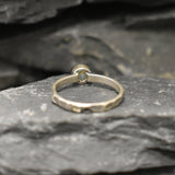 Ethiopian Opal ring in a dainty boho solitaire with a hammered band and oxidized silver bezel showing flashes of fire colors; the protective bezel and textured finish are comfortable for daily wear and help hide small scratches. Thoughtful October Birthstone gift for meaningful minimalist jewelry lovers.
Worn for office days, brunch dates, music festivals, casual weekends, and small weddings.