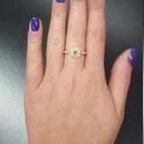 Fire Opal Flower Ring styled on middle finger with deep purple nail polish, showcasing its flashes of fire colors against the sterling silver bubble band. Known for uplifting moods and inspiring originality, this October birthstone gift idea is a nature-inspired treasure. Perfect for autumn weddings, evening soirées, and milestone celebrations.