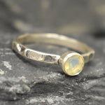 Ethiopian Opal ring in a dainty boho solitaire with a hammered band and oxidized silver bezel showing flashes of fire colors; the protective bezel and textured finish are comfortable for daily wear and help hide small scratches. Thoughtful October Birthstone gift for meaningful minimalist jewelry lovers.
Worn for office days, brunch dates, music festivals, casual weekends, and small weddings.