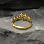 Ethiopian Opal Bypass Ring in gold with six cabochon stones aligned in a curved wrap setting, a stylish jewelry design that radiates flashes of fire colors and adds a modern edge, making it a thoughtful October birthstone gift idea. Perfect to wear at weddings, cocktail parties, and romantic dinners for a bold yet refined look.