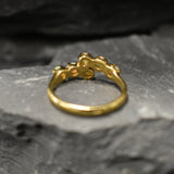 Ethiopian Opal Bypass Ring in gold with six cabochon stones aligned in a curved wrap setting, a stylish jewelry design that radiates flashes of fire colors and adds a modern edge, making it a thoughtful October birthstone gift idea. Perfect to wear at weddings, cocktail parties, and romantic dinners for a bold yet refined look.