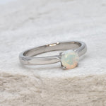 Natural Fire Opal solitaire ring set in 18k solid white gold, a timeless jewelry piece symbolizing creativity and passion, the perfect October birthstone gift for anniversaries, engagements, or milestone celebrations.