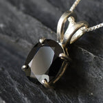 Onyx pendant believed to promote grounding energy and boost inner stability.
