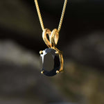 Onyx pendant believed to promote grounding energy and strong inner focus.