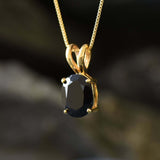 Onyx pendant believed to promote grounding energy and strong inner focus.