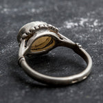 Australian Opal Ring in sterling silver with a horizontal oval cabochon design, white stone showing flashes of fire colors, delicate jewelry style for everyday elegance, meaningful October birthstone gift idea. Perfect for weddings, anniversaries, cocktail parties, and milestone events.