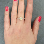 Fire Opal Bezel Ring showcased on hand with minimal nail art, tennis band design highlighting flashes of fire colors, brings confidence and balance as an October birthstone, perfect for coffee dates, daytime events, or casual dinners.