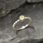 Yellow Fire Opal Bubble Band Ring in sterling silver with bezel set round cut, showcasing flashes of fire colors in a tennis band design for an elegant jewelry style. This durable and timeless piece is a meaningful October birthstone gift idea, symbolizing passion and inspiration. Ideal for birthdays, weddings, anniversaries, and evening occasions where a touch of unique brilliance is desired.