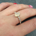 Fire Opal Ring worn on middle finger with bright red nails, styled with striped accent nail art, perfect for expressing individuality and charm, makes a thoughtful October birthstone gift, ideal for casual outings and birthday parties.