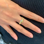 Fire Opal Bypass Cabochon Ring with flashes of fire colors worn on ring finger with nude nails, perfect for pairing with casual dresses or daily wear, symbolizing creativity and love, an ideal October birthstone accessory for brunches, date nights, and anniversaries.