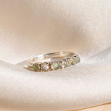 Natural Fire Opal cabochon half eternity ring in solid 925 sterling silver, designed with dainty cabochon stones for timeless elegance and flashes of fire colors. This ring highlights durability and everyday wear while being lightweight and comfortable. As the October Birthstone, Fire Opal makes a meaningful gift for birthdays, anniversaries, or special occasions. Perfect to wear at weddings, cocktail parties, and festive celebrations.