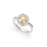 Ethiopian Opal diamond cut halo ring in solid 925 sterling silver, surrounded by sparkling CZ accents for brilliance and elegance. The halo design highlights flashes of fire colors while offering timeless durability. As the October Birthstone, Opal makes a meaningful gift for birthdays, engagements, anniversaries, or personal milestones. Perfect to wear at weddings, cocktail parties, and festive gatherings.