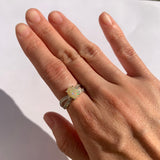 Fire Opal Ring worn on ring finger in natural daylight with bare nails perfect for enhancing elegance and emotional positivity suited for anniversaries or daytime events.
