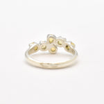 Fire Opal bypass ring in sterling silver with cabochon cut gemstones showcasing flashes of fire colors, crafted in a dainty jewelry style, believed to inspire joy and passion, a meaningful October birthstone gift idea for engagements, birthdays, and cocktail parties.