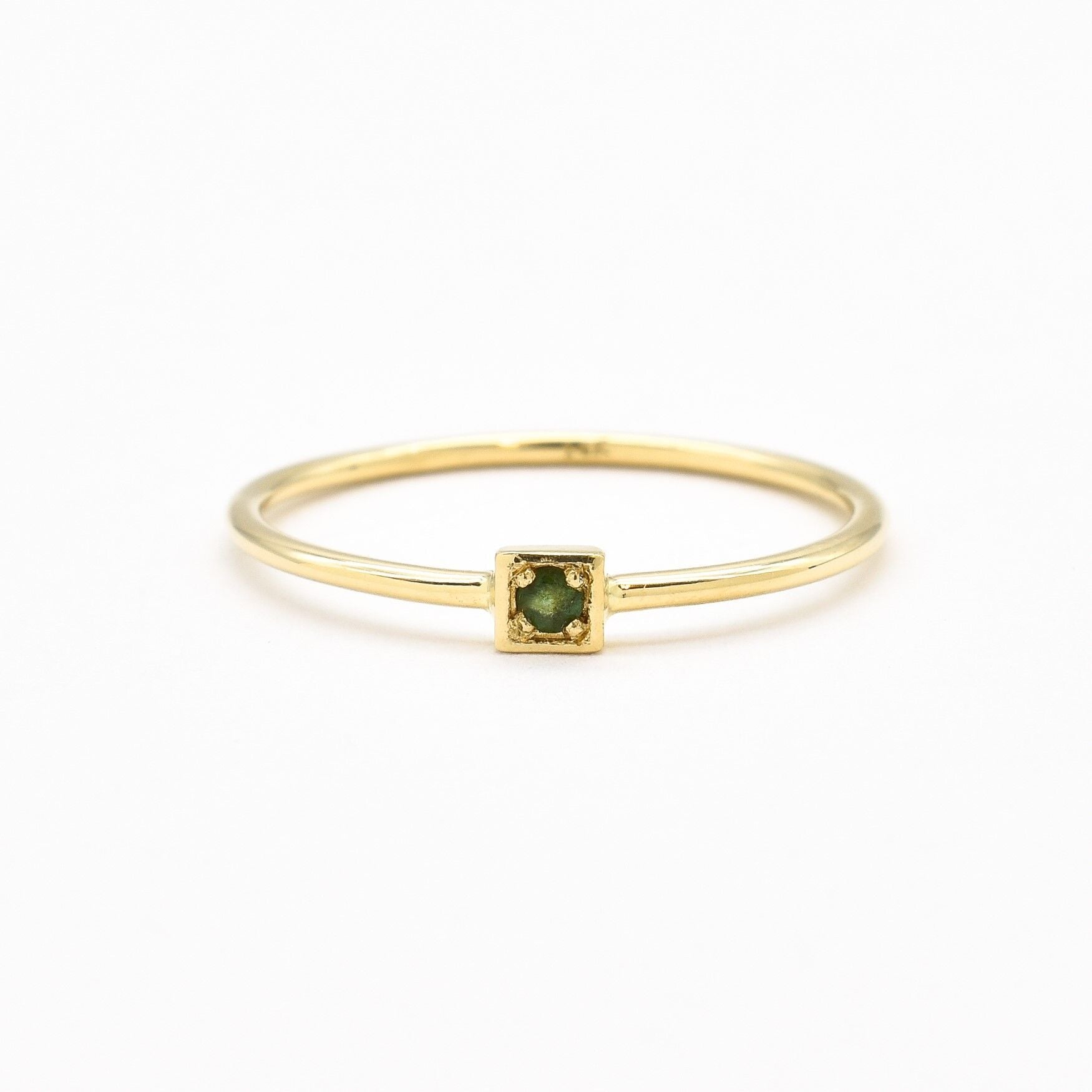 Genuine Emerald Ring set in Solid 14k Yellow Gold, in a dainty round cut, and natural green color. May birthstone ring that encourages growth, harmony, and deep emotional healing. Minimalist solid gold ring, perfect for everyday wear, and an ideal may birthday gift idea, or anniversary present.