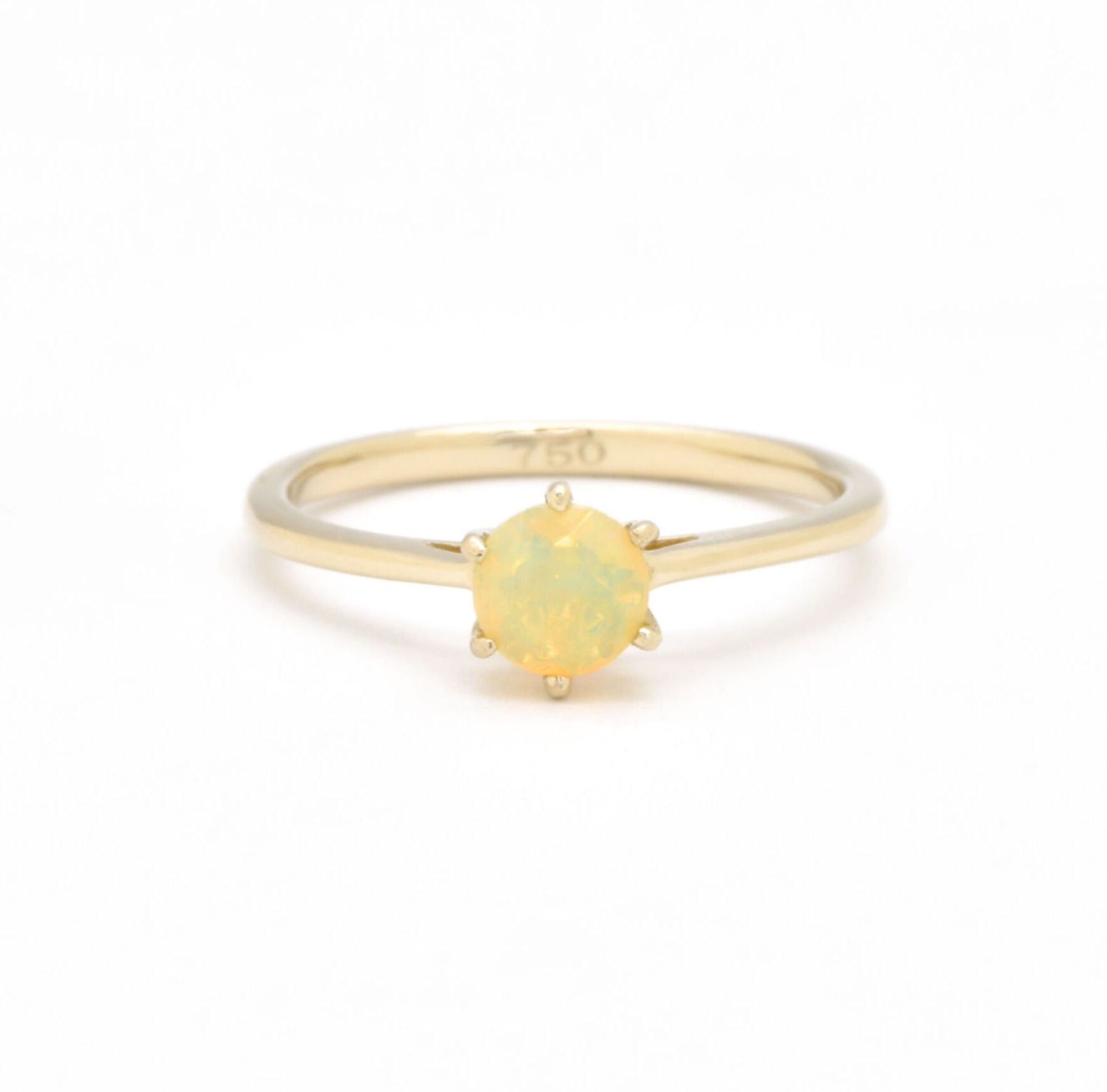 Genuine Fire Opal solitaire ring in 14k solid yellow gold with flashes of fire colors, symbolizing passion and creativity, perfect as an October birthstone engagement, anniversary, or milestone gift.