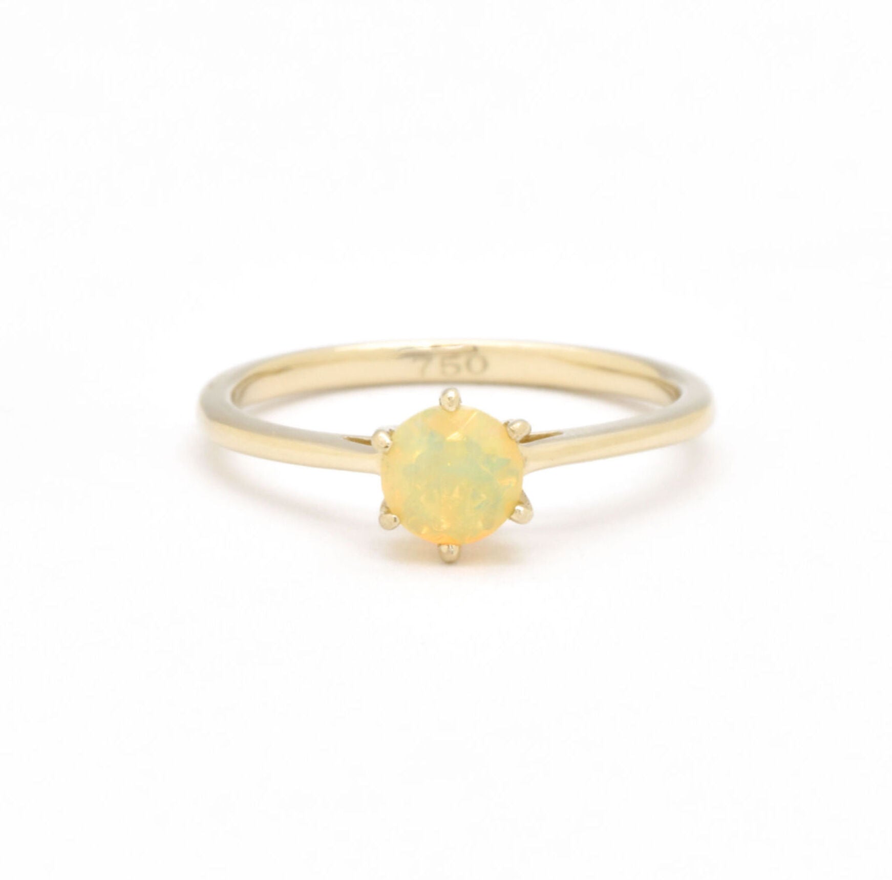 Genuine Fire Opal solitaire ring in 14k solid yellow gold with flashes of fire colors, symbolizing passion and creativity, perfect as an October birthstone engagement, anniversary, or milestone gift.