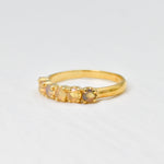 Ethiopian Opal eternity ring in gold with round diamond cut stones, ideal for stacking or wearing solo, symbolizing endless love and inspiration, a meaningful October birthstone gift for weddings, anniversaries, and milestone celebrations.