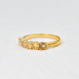 Ethiopian Opal eternity ring in gold with round diamond cut stones, ideal for stacking or wearing solo, symbolizing endless love and inspiration, a meaningful October birthstone gift for weddings, anniversaries, and milestone celebrations.