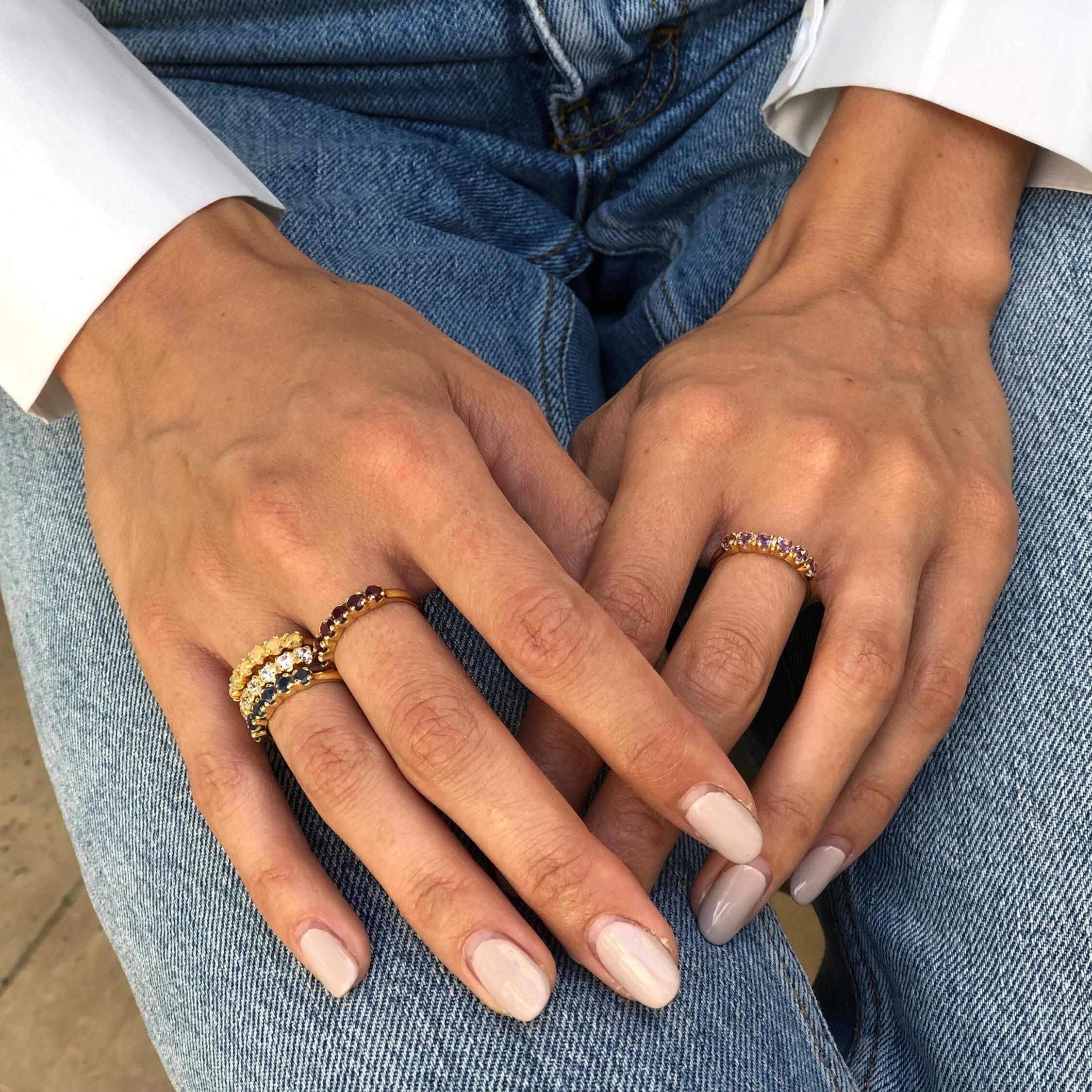 Gold Ethiopian Opal Eternity Ring paired with light denim jeans and crisp white shirt, a casual yet refined look that brings elegance and positivity, perfect for weekend brunches and special gatherings.