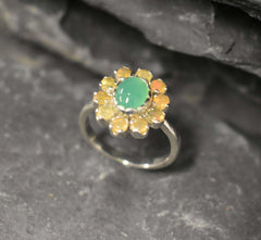 Chrysoprase and Opal Flower Ring in sterling silver featuring a green cabochon chrysoprase center framed with diamond cut opal petals, a statement jewelry style that enhances confidence and creativity while offering flashes of fire colors, making it a meaningful October birthstone gift idea. Perfect for weddings, formal dinners, and festive occasions to showcase elegance and charm.