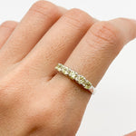 Green Peridot ring styled with natural skin tone and simple nails, perfect for casual or formal occasions, adding subtle elegance to any look.