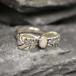 Opal ring in handcrafted solid silver with a ribbon bow style band and white cabochon showing flashes of fire color, a statement design that brightens the hand. Brings creative spark and calm confidence while adding a luminous white accent to any look. A thoughtful October birthstone gift idea for someone special.
Wear to weddings, anniversaries, engagements, date nights, office parties, graduations, and holiday gatherings.