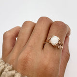 Rose Gold Vine Opal Ring worn on index finger with natural nails, perfect for bringing emotional balance and a touch of nature-inspired elegance, ideal for garden weddings or spring gatherings.