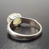 Ethiopian Fire Opal Sterling Silver Ring featuring a horizontal oval cut with a secure 4-prong setting. The engraved ornament band adds vintage charm, while the opal displays brilliant flashes of fire colors. A timeless October birthstone ring, perfect for birthdays, anniversaries, weddings, and milestone celebrations.