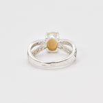 Natural Fire Opal diamond cut in a split sterling silver band with sparkling CZ Diamond accents offering vibrant energy and charm perfect as an October birthstone gift for engagements anniversaries or special celebrations.