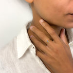 Woman wearing dainty natural Emerald Ring in Solid 14k Yellow Gold worn for size reference. May birthstone ring for growth, and harmony, perfect for everyday wear, for ring stacking, and for minimalist styling.