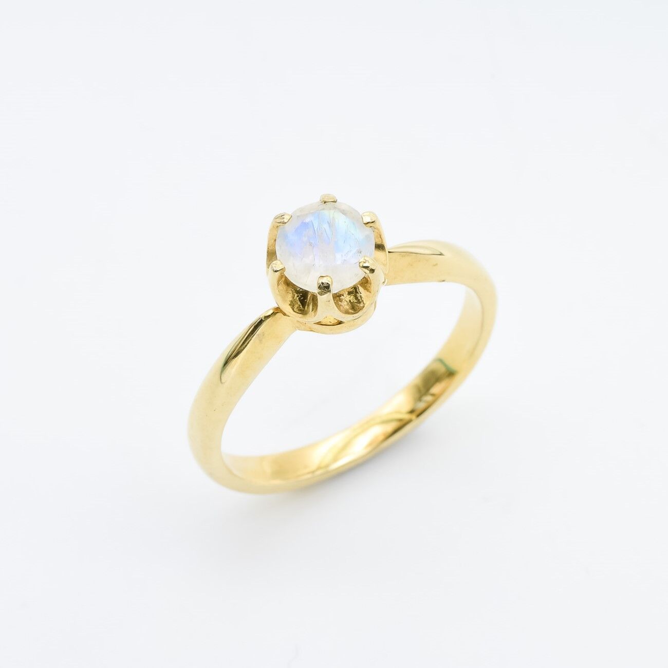 Moonstone ring with a delicate round cut offering a dreamy, ethereal style.
