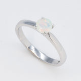 Natural Fire Opal solitaire ring set in 18k solid white gold, a timeless jewelry piece symbolizing creativity and passion, the perfect October birthstone gift for anniversaries, engagements, or milestone celebrations.