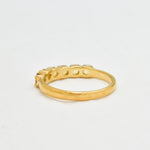 Ethiopian Opal eternity ring in gold with round diamond cut stones, ideal for stacking or wearing solo, symbolizing endless love and inspiration, a meaningful October birthstone gift for weddings, anniversaries, and milestone celebrations.