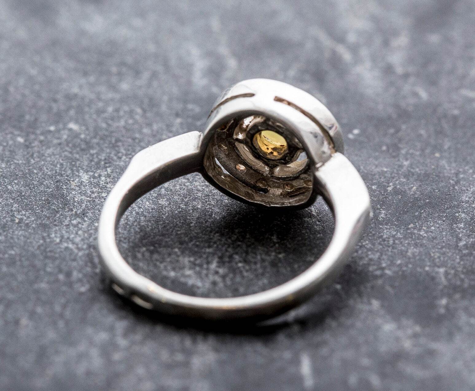 Ethiopian Opal diamond cut halo ring in solid 925 sterling silver, surrounded by sparkling CZ accents for brilliance and elegance. The halo design highlights flashes of fire colors while offering timeless durability. As the October Birthstone, Opal makes a meaningful gift for birthdays, engagements, anniversaries, or personal milestones. Perfect to wear at weddings, cocktail parties, and festive gatherings.