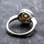 Ethiopian Opal diamond cut halo ring in solid 925 sterling silver, surrounded by sparkling CZ accents for brilliance and elegance. The halo design highlights flashes of fire colors while offering timeless durability. As the October Birthstone, Opal makes a meaningful gift for birthdays, engagements, anniversaries, or personal milestones. Perfect to wear at weddings, cocktail parties, and festive gatherings.