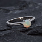 Natural Fire Opal solitaire ring set in 18k solid white gold, a timeless jewelry piece symbolizing creativity and passion, the perfect October birthstone gift for anniversaries, engagements, or milestone celebrations.
