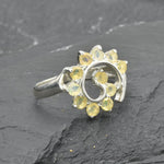 Opal Spiral Ring in sterling silver designed as a sunburst swirl statement jewelry piece offering radiant flashes of fire colors and boho charm, believed to inspire creativity and positivity, making it a thoughtful October birthstone gift idea. Perfect to wear at weddings, parties, and special occasions for a vibrant standout look.