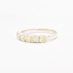 Natural peridot band ring with diamond cut stones in sterling silver, perfect for adding a touch of green elegance to your jewelry collection.