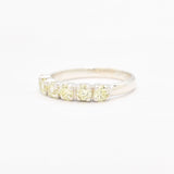 Natural peridot band ring with diamond cut stones in sterling silver, perfect for adding a touch of green elegance to your jewelry collection.