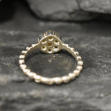 Flower Fire Opal Ring in solid 925 Sterling Silver with dainty bubble band style, designed with flashes of fire colors. Known for its energy of inspiration and positivity, this October birthstone makes a meaningful gift idea for nature lovers and those who adore dainty jewelry styles.
Perfect for anniversaries, birthdays, weddings, and romantic evening events.