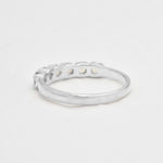 Natural Fire Opal half eternity ring in solid sterling silver, featuring a row of cabochon cut opals, a dainty jewelry piece symbolizing balance and creativity, an ideal October birthstone gift for anniversaries, weddings, or milestone celebrations.