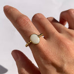 Natural Opal beaded gold ring worn on a bare hand with a sunlit background, offering a minimalist and elegant look, perfect for everyday wear, casual outings, or as a thoughtful October birthstone gift.