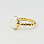Natural Opal beaded gold ring with a smooth cabochon cut gemstone, offering a minimalist yet elegant style perfect for everyday wear. Opal, the October birthstone, is believed to inspire creativity and emotional balance, making it a meaningful gift for birthdays, anniversaries, weddings, and milestone celebrations.