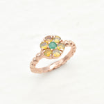 Natural Opal and Emerald Rose Gold Ring ring in a floral cluster design, symbolizing love and harmony, a meaningful jewelry gift for October and May birthstones, ideal for anniversaries, engagements, or milestone celebrations.