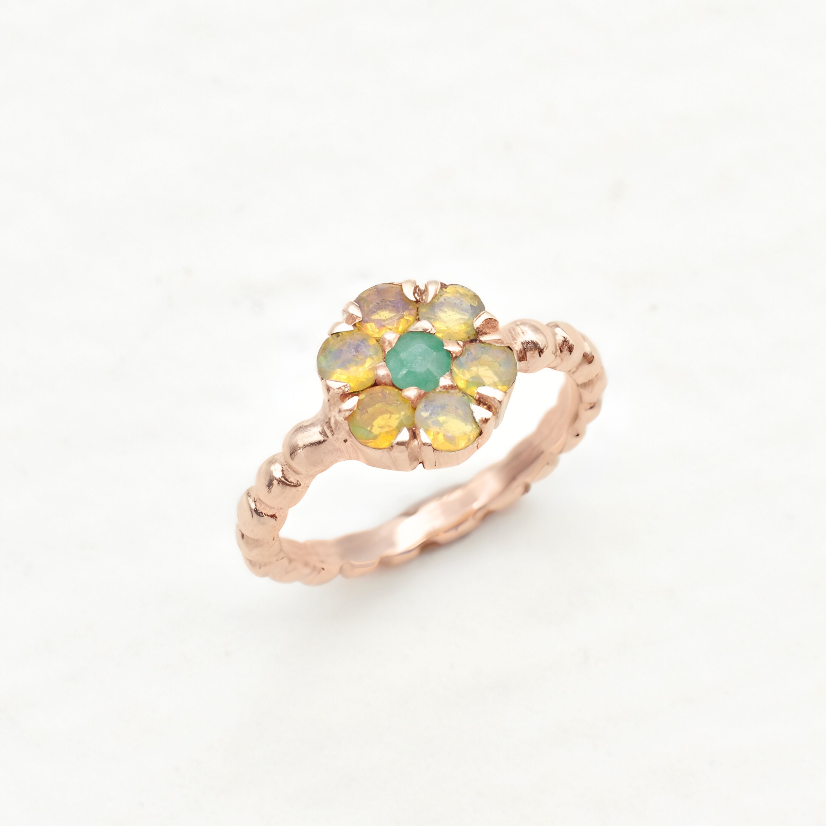 Natural Opal and Emerald Rose Gold Ring ring in a floral cluster design, symbolizing love and harmony, a meaningful jewelry gift for October and May birthstones, ideal for anniversaries, engagements, or milestone celebrations.
