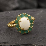 Opal halo floral ring with Genuine Emeralds in a vintage victorian flower halo, White cabochon center, and beaded Bubble Band for a bold statement cocktail look showing flashes of fire colors. Benefits include creativity, harmony, and calm. Ideal October birthstone gift with meaningful May emerald accents.
Worn for weddings, cocktail parties, anniversaries, graduations, garden events, and holiday gatherings.